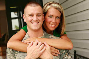 Air Force member hugging his wife